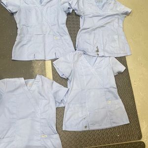 4 of the same scrub tops, ceil blue some in better condition, some ink stains